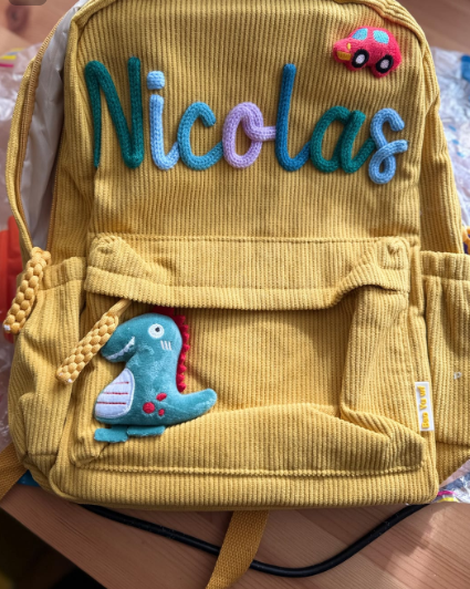 Mustard yellow knitted backpack embroidered 'Nicolas' with dino charm